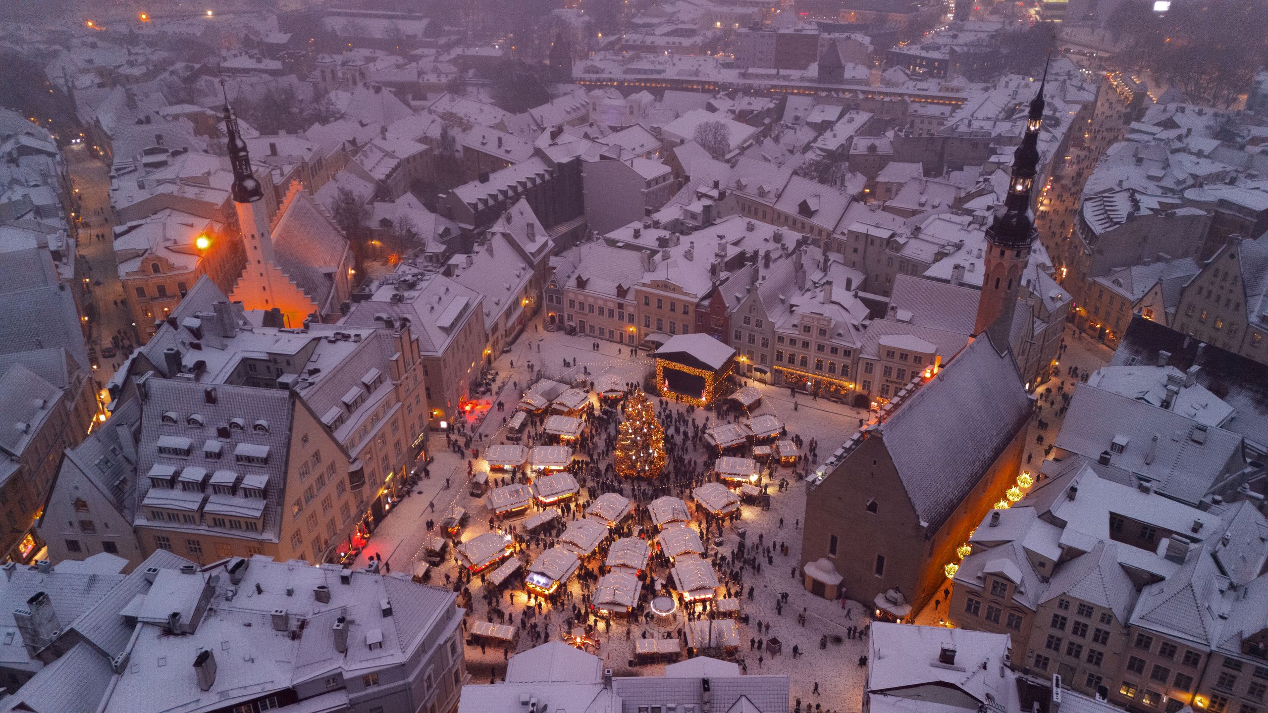 Cobbled lane climbing toward St. Olaf's spire in Tallinn Vanalinn